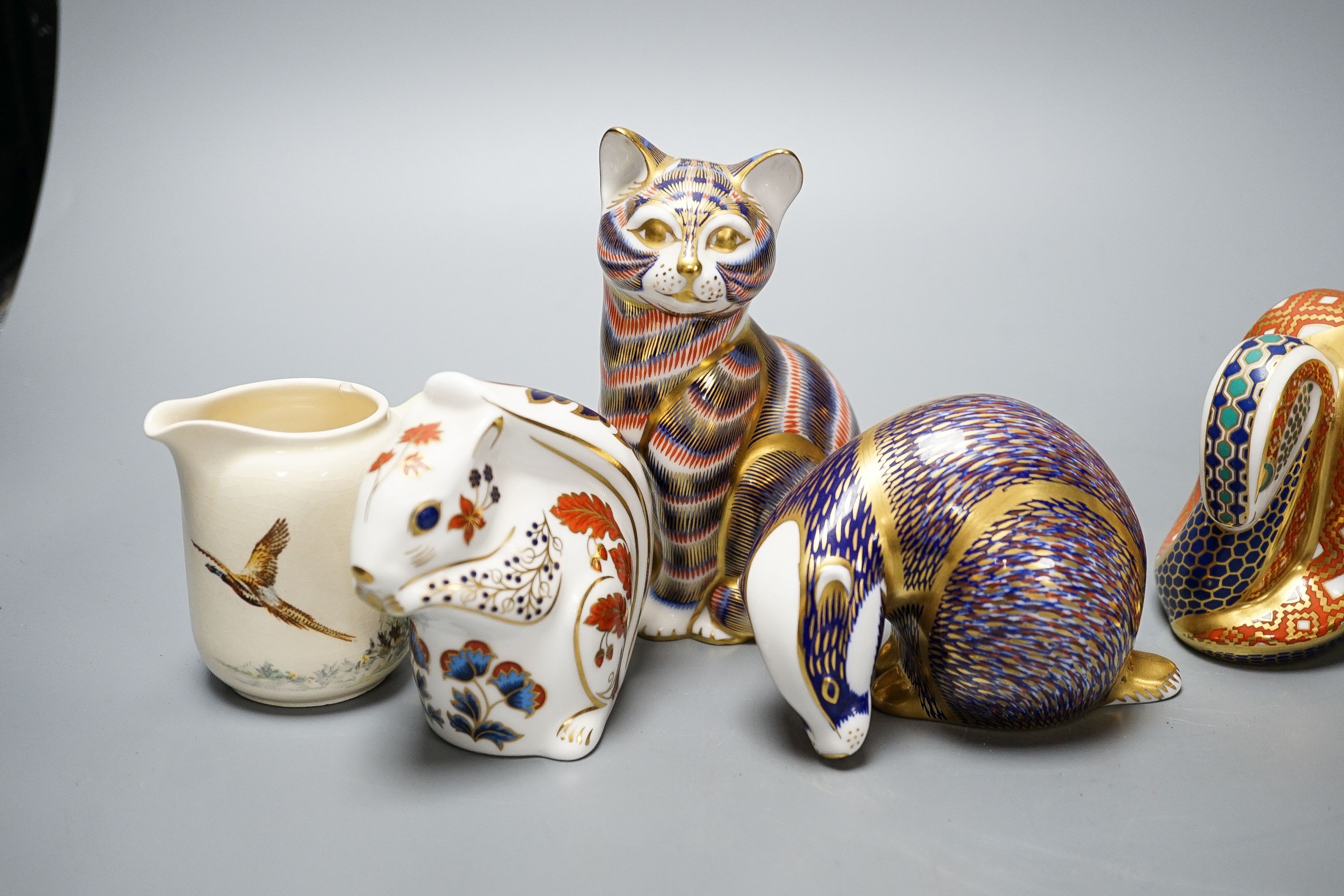 Four Royal Crown Derby paperweights, a Royal Doulton jug, a Belleek jug and a Wedgwood Noah’s ark collection hare